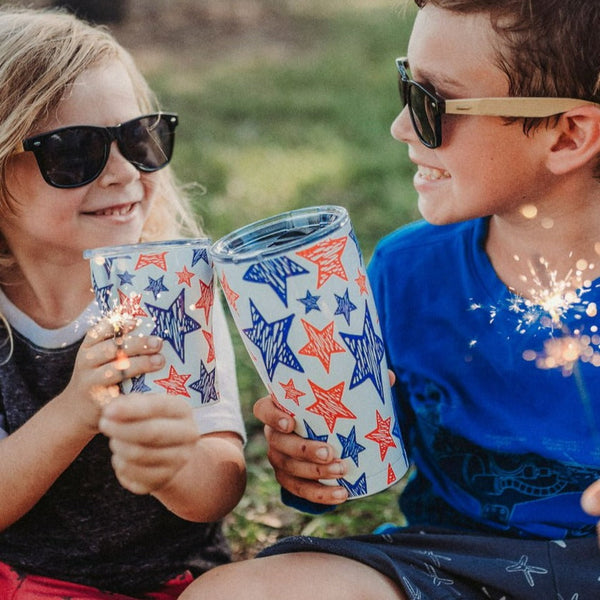 2 kids holding SIC cups and Sparklers